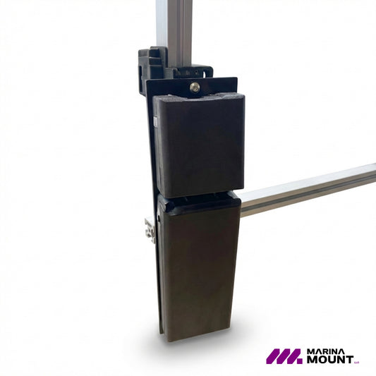 Black padded boat bumper positioned on a vertical dock upright mounting system