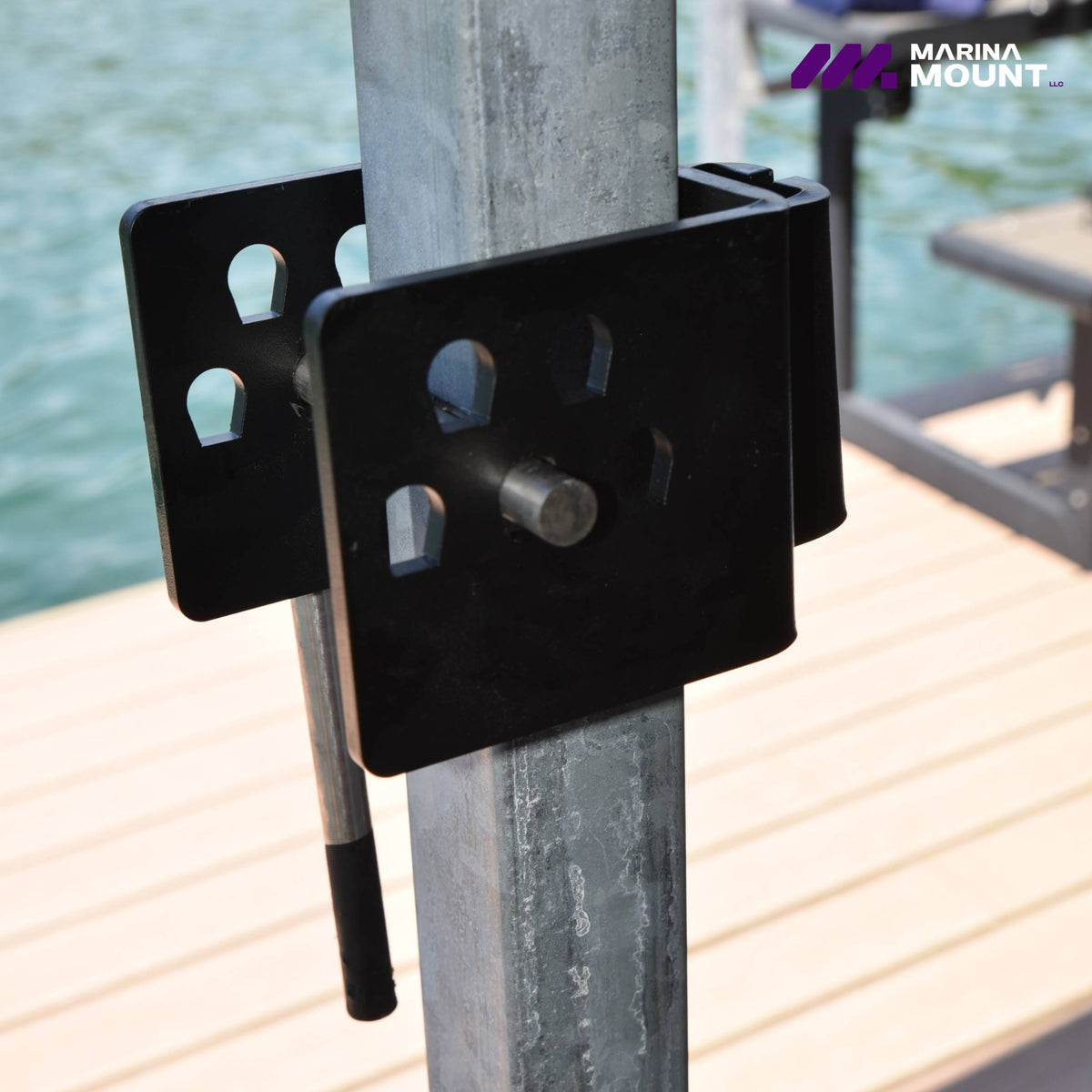 Marina Mount attachment system secured to a square metal dock post beside the water